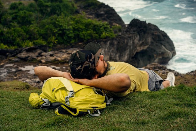 handsome-bearded-man-traveler-with-backpack-is-resting-beautiful-place-rock.jpg