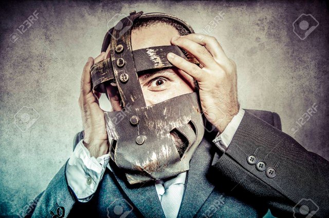 32659250-terror-business-man-with-iron-mask.jpg