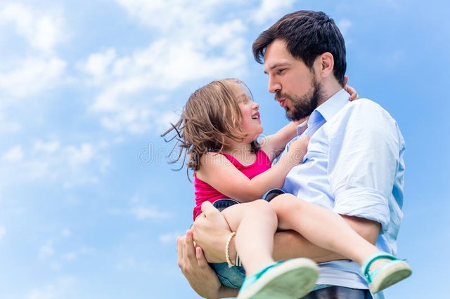 father-carrying-daughter-protecting-her-his-hands-57990310.jpg