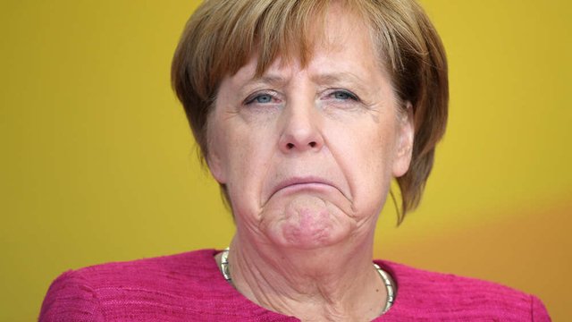 1069481033-angela-merkel-mFjuz0cjXIRp8ggTNG.jpg