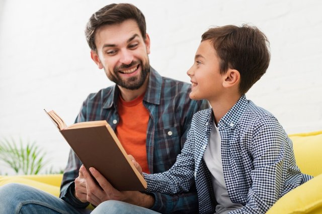 happy-father-son-reading_23-2148350718.jpg