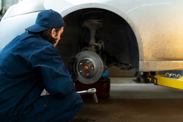 male-car-mechanic-working-car-repair-shop.jpg