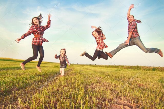 depositphotos_75052113-stock-photo-family-jumping-in-the-field.jpg