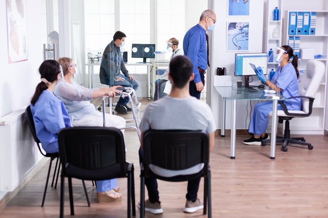 disabled-senior-woman-with-walking-frame-sitting-hospital-waiting-area-medical-consultation-against-infection-with-coronavirus_482257-8530.jpg