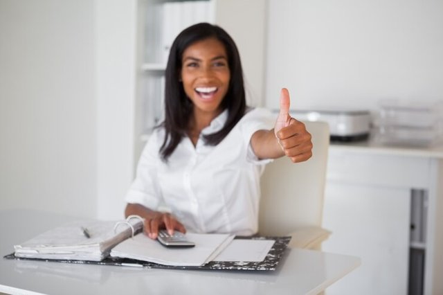 pretty-businesswoman-showing-thumb-up-camera-her-desk_13339-101565.jpg