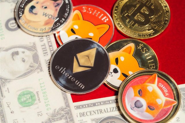 1920-dogecoin-doge-bitcoin-ethereum-eth-shiba-coin-included-with-crypto-currency-coin-on-stack-100-hundred-new-us-dollar-money-american-virtual-blockchain-technology-future-is-money-close-up-concept(1).jpg