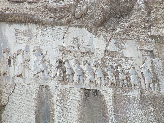 Bisotun_Iran_Relief_Achamenid_Period public domain.JPG