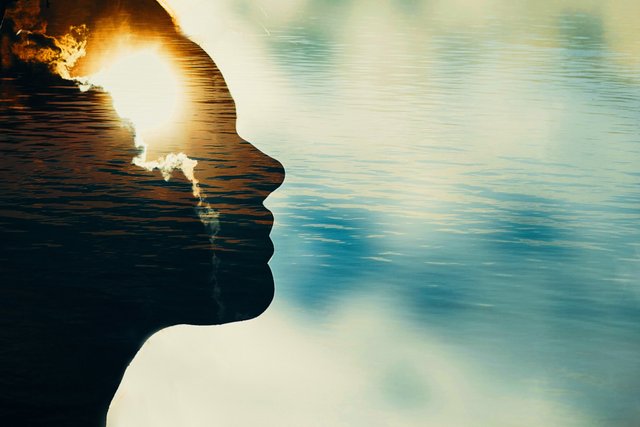woman-silhouette-with-sun-head-with-copy-space-multiple-exposure-image.jpg