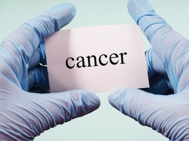 hands-medical-gloves-hold-sign-with-inscription-cancer_83196-1518.jpg