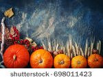 stock-photo-a-table-decorated-with-pumpkins-harvest-festival-happy-thanksgiving-698011423.jpg