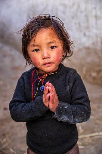 namaste-portrait-of-tibetan-little-girl-upper-mustang-nepal.jpg