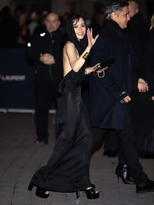 jenna-ortega-saint-laurent-hooded-dress-paris-fashion-week (4).webp