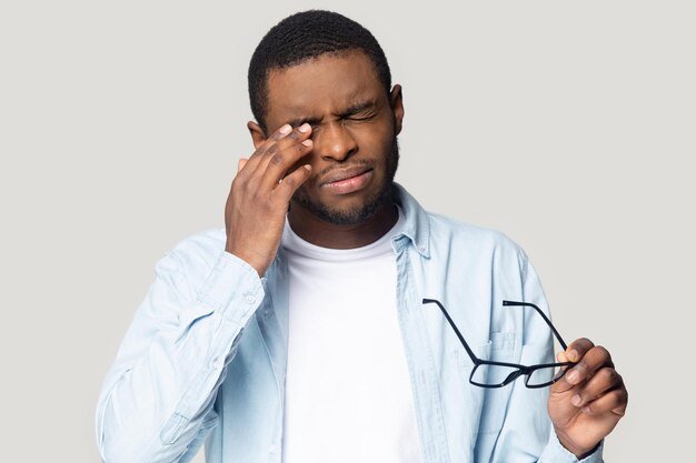 african-american-male-take-off-glasses-suffering-from-headache_656932-5548.jpg