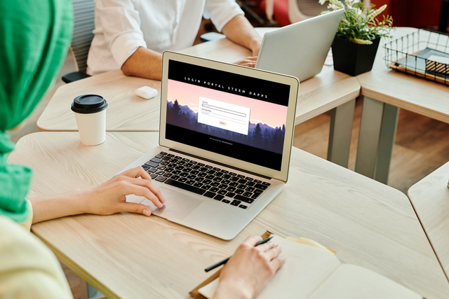 Woman using MacBook Air in the office_login Portal_20221228_013802_0000.png