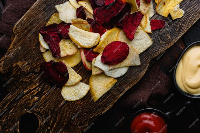 root-vegetable-crisps-black-wooden-table-background-top-view-flat-lay_249006-20244.jpg