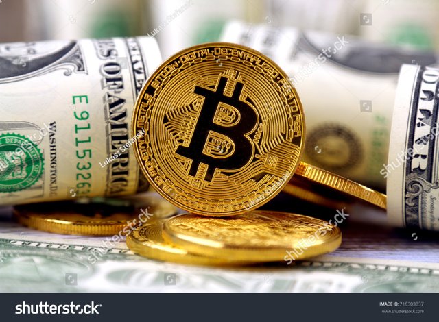 1 - stock-photo-physical-version-of-bitcoin-new-virtual-money-and-banknotes-of-one-dollar-exchange-bitcoin-for-a-718303837.jpg