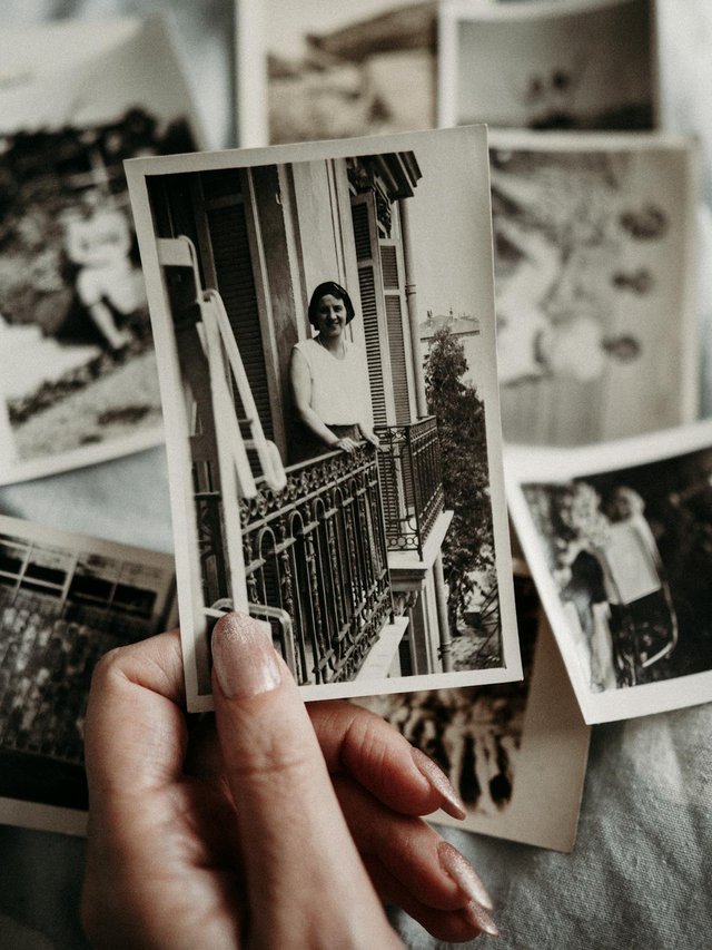 free-photo-of-woman-with-old-analog-photographs.jpeg