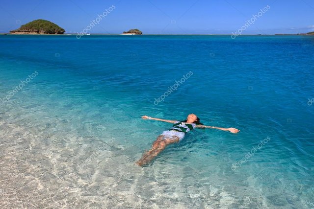 depositphotos_21671309-stock-photo-woman-swiming-at-the-beach.jpg