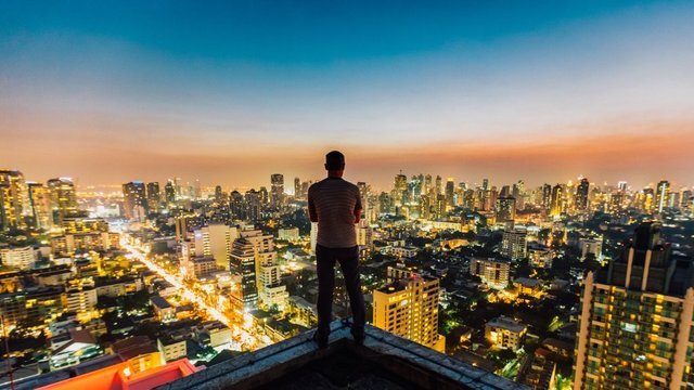 Man Standing on Top over looking City.jpg
