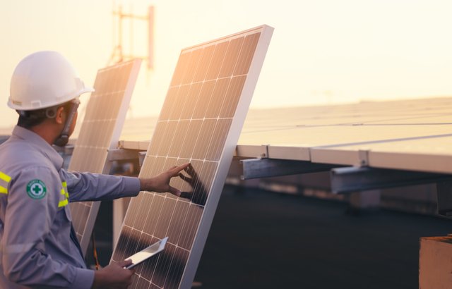 engineer-solar-photovoltaic-panels-station-checks-with-tablet-computer-energy-technology-concept (1).jpg