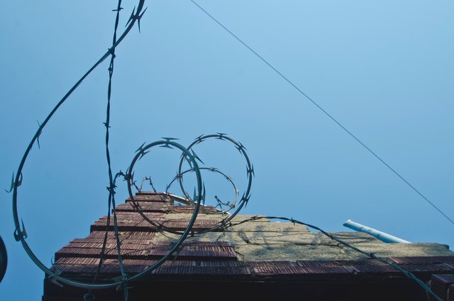 Looking up the razor wire wall.JPG