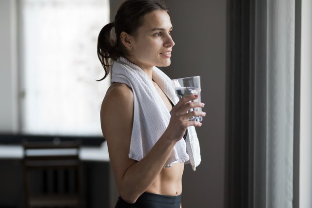 side-view-female-with-glass-water-towel-shoulders (1).jpg