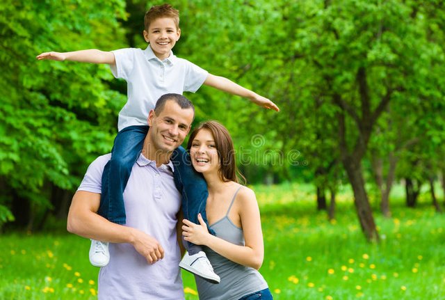 happy-family-three-father-keeps-son-shoulders-35294664.jpg