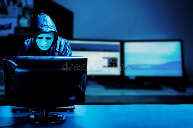 anonymous-computer-hacker-white-mask-hoodie-obscured-dark-face-standing-middle-hacking-his-data-thief-internet-153892619.jpg