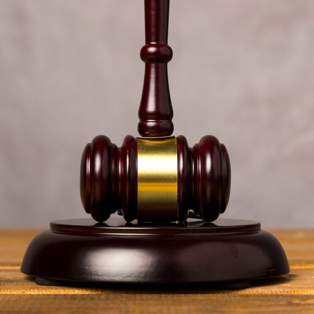 close-up-judge-gavel-with-its-striking-block_23-2148230087.jpg