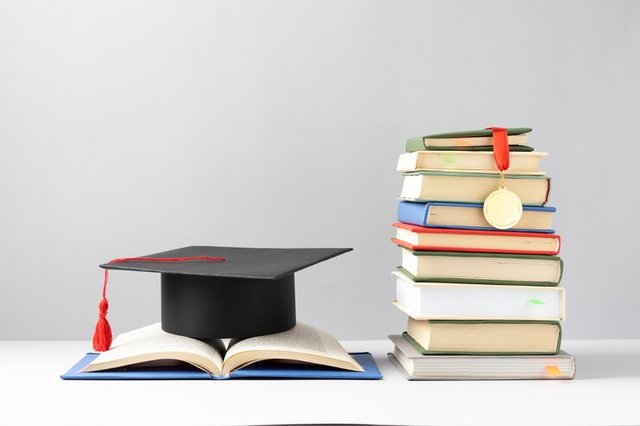 front-view-stacked-books-graduation-cap-open-book-education-day_23-2149241017.jpg