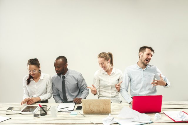 young-african-caucasian-men-women-sitting-office-working-laptops-business-emotions-team-teamwork-workplace-leadership-meeting-concept-different-emotions-colleagues.jpg