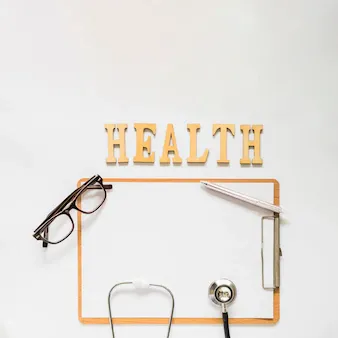 health-text-near-clipboard-with-eyeglasses-stethoscope-pen-white-background_23-2147883654.webp