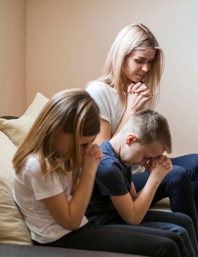 front-view-family-praying-home_23-2148543569.jpg