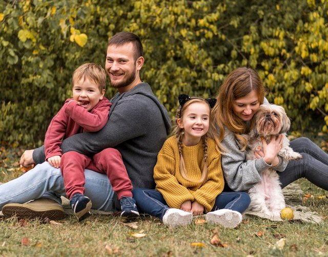 happy-family-with-dog-outdoors_23-2148748731.jpg