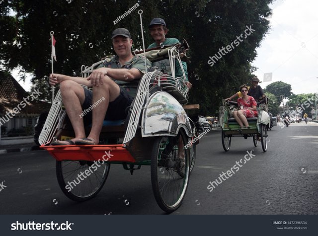 stock-photo-horse-drawn-carriages-and-rickshaws-preferred-by-tourists-as-a-shuttle-vehicle-in-the-city-1472396534.jpg