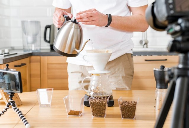 close-up-man-holding-kettle_23-2148551570.jpg