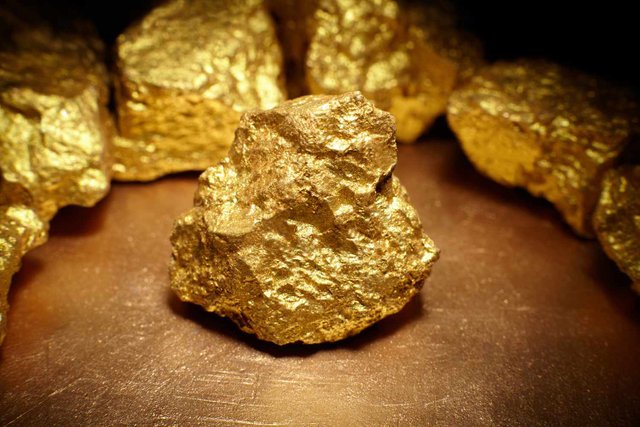 closeup-of-big-gold-nugget-511603038-5ad92a97fa6bcc00362b919b.jpg