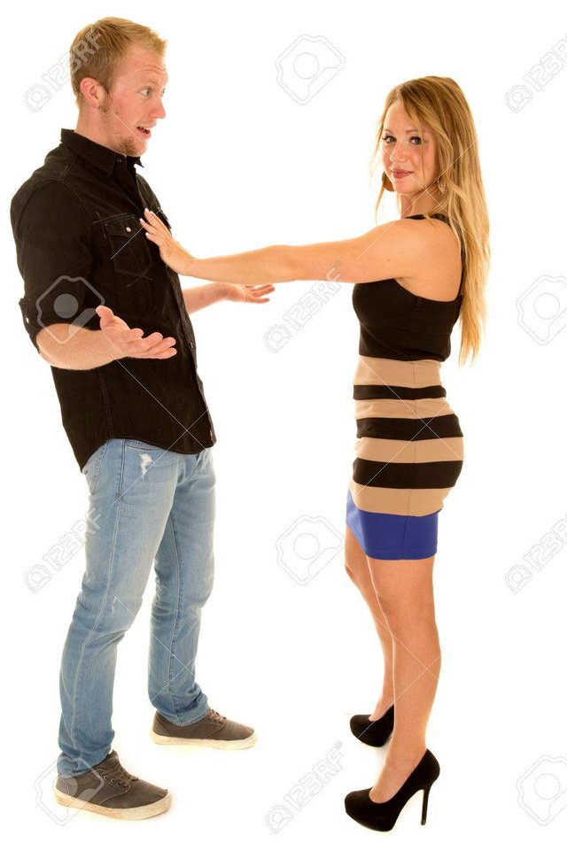 51648483-a-woman-with-her-hand-on-a-man-s-chest-telling-him-to-back-off-.jpg