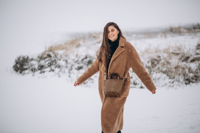 woman-happy-coat-winter-outside-park_1303-13285.jpg