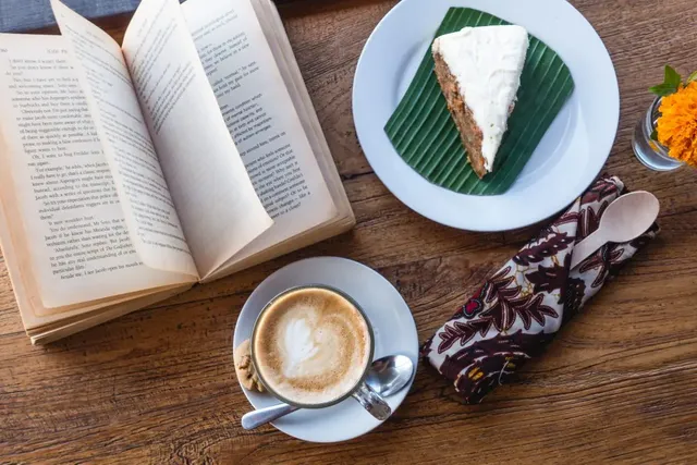 relaxing-with-coffee-cake-and-book.webp