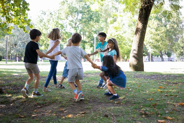 happy-children-playing-together-outdoors-dancing-around-grass-enjoying-outdoor-activities-having-fun-park-kids-party-friendship-concept.jpg