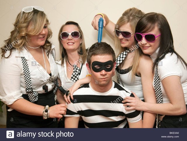 teenagers-dressed-up-to-go-to-a-cops-and-robbers-fancy-dress-party-BKEXA0.jpg