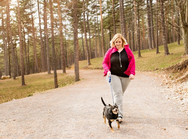 woman exercising with dog.jpg