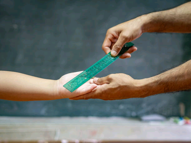 teacher-use-the-ruler-hit-the-kids-hand-for-punishment.jpg