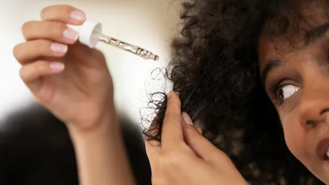woman-using-hair-product-side-view_23-2149659594.webp