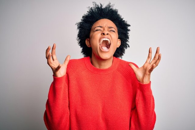 young-beautiful-african-american-afro-woman-with-curly-hair-wearing-red-casual-sweater-celebrating-mad-crazy-success-with-arms-raised-closed-eyes-screaming-excited-winner-concept_839833-24935.jpg