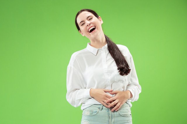 happy-business-woman-standing-smiling-isolated-green-studio_155003-23594.jpg