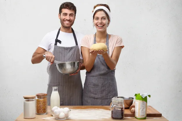 products-food-cuisine-cooking-concept-portrait-happy-positive-young-european-couple-baking-homemade-bread_273609-8408.webp