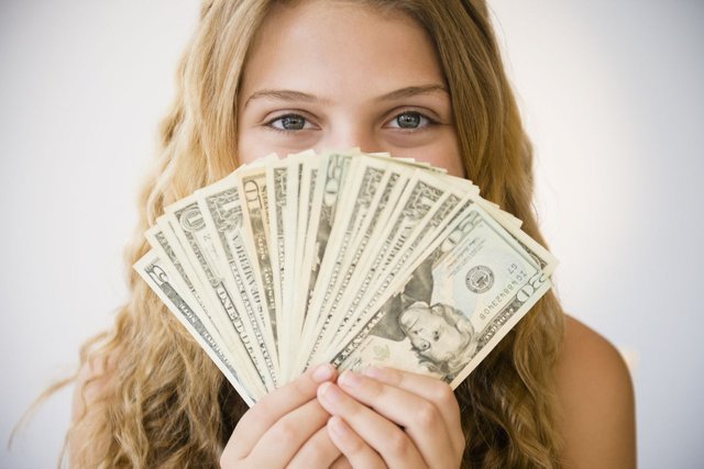 inspired-2015-06-money-cash-bills-woman-getty-main.jpg