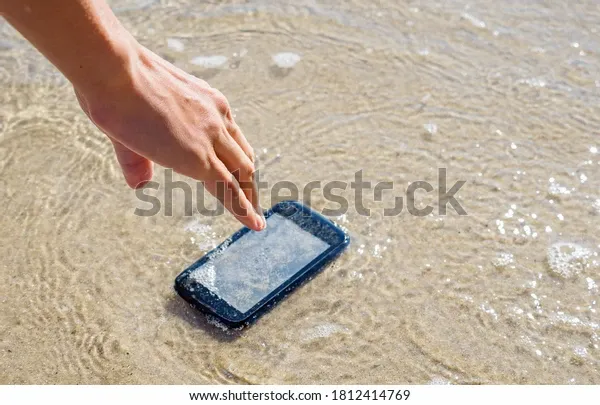 woman-dropped-her-smartphone-into-600w-1812414769.webp